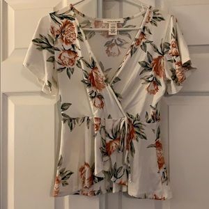 Soft floral wrap tee with tie detail.